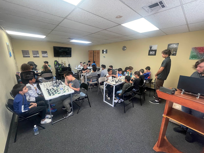 Kids playing chess during a class at the Masterpiece studio in Santa Clarita